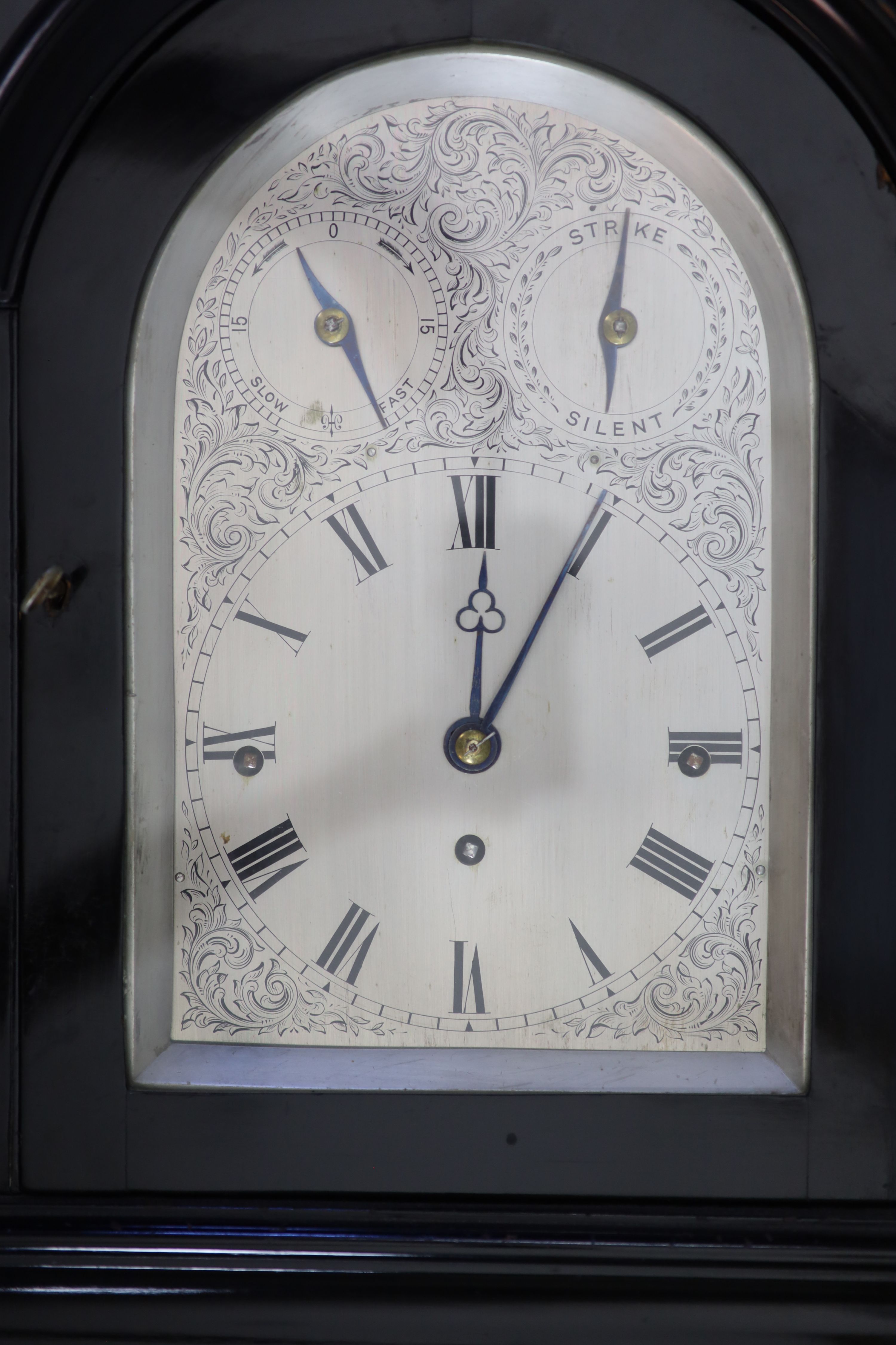 A large late Victorian ebonised bracket clock with bracket